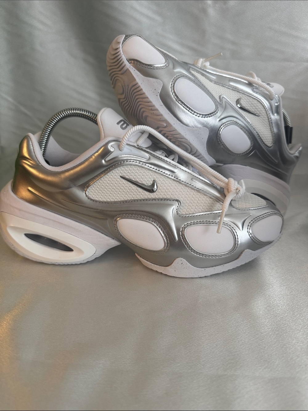 New! Nike Air Max Muse women sneakers in the metallic silver and white colorway.